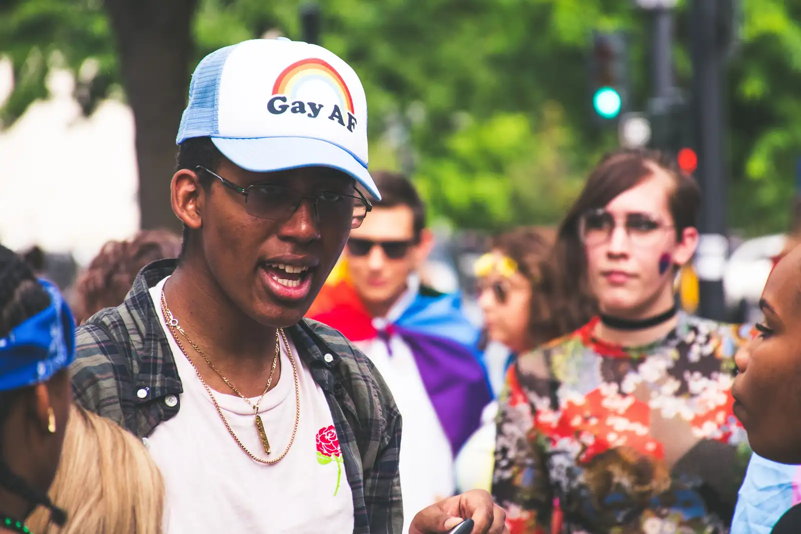 Participants celebrating at an LGBTQ+ pride event outdoors
