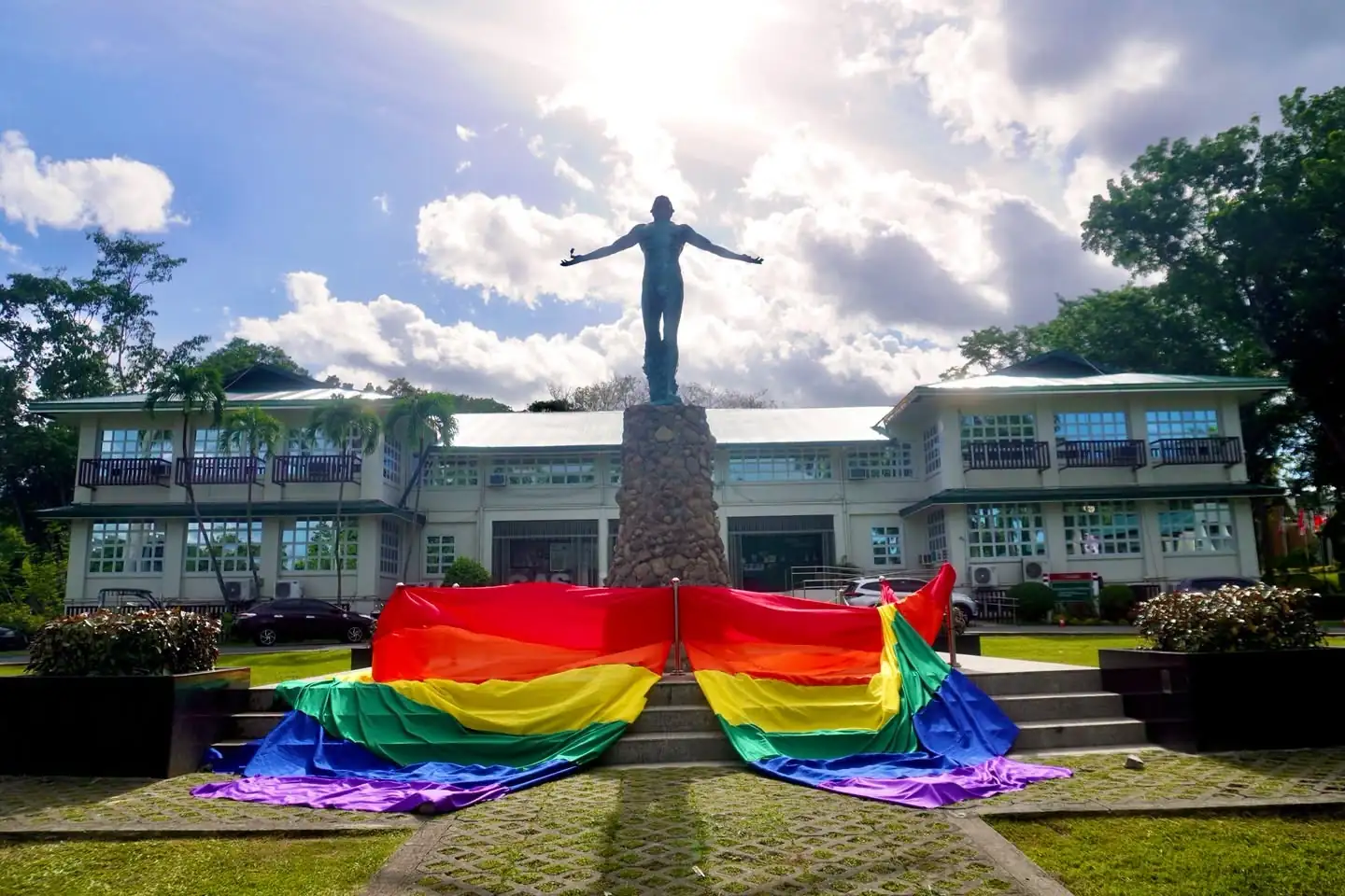 Rainbow flag at Oblation statue