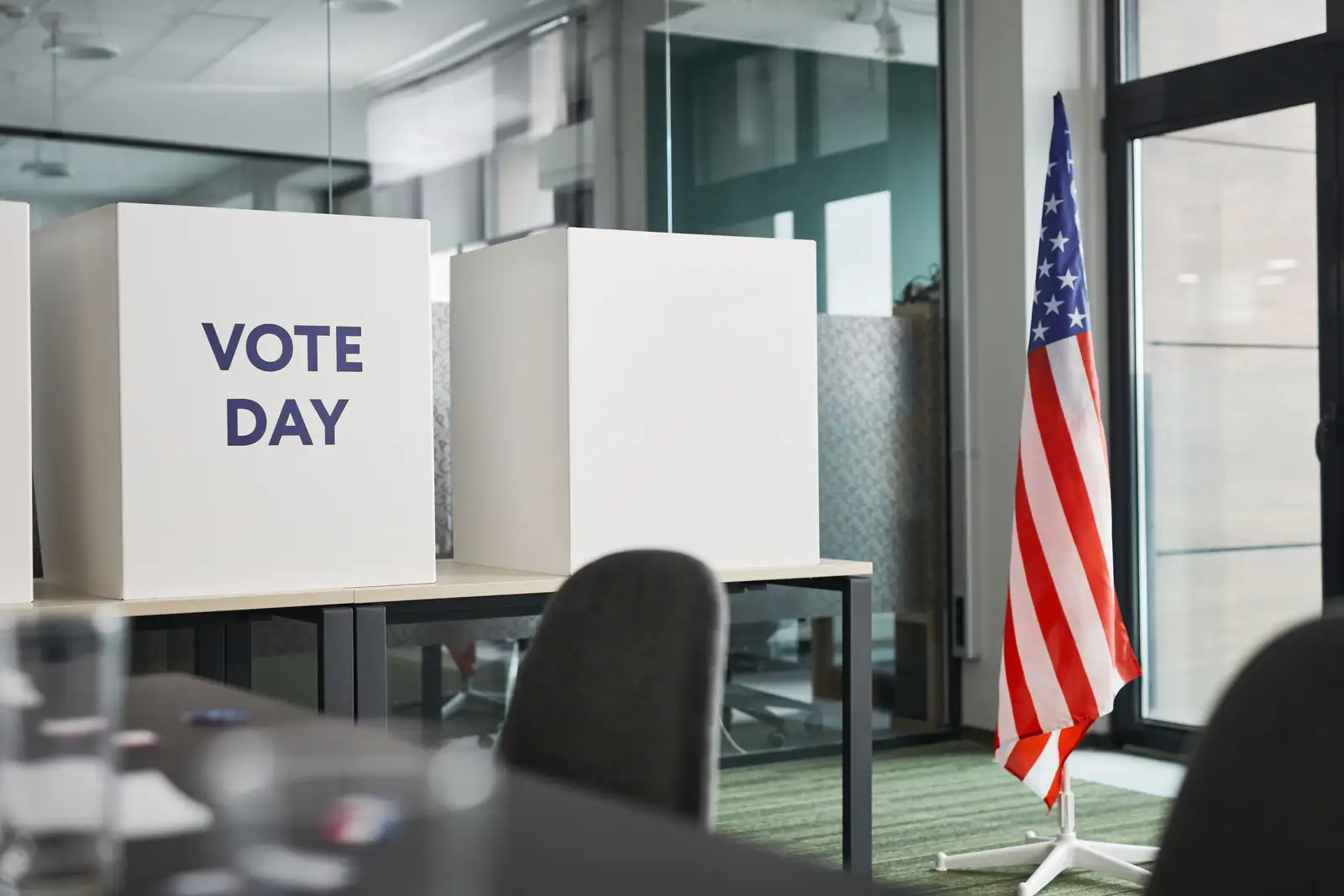 American flag and voting boxes